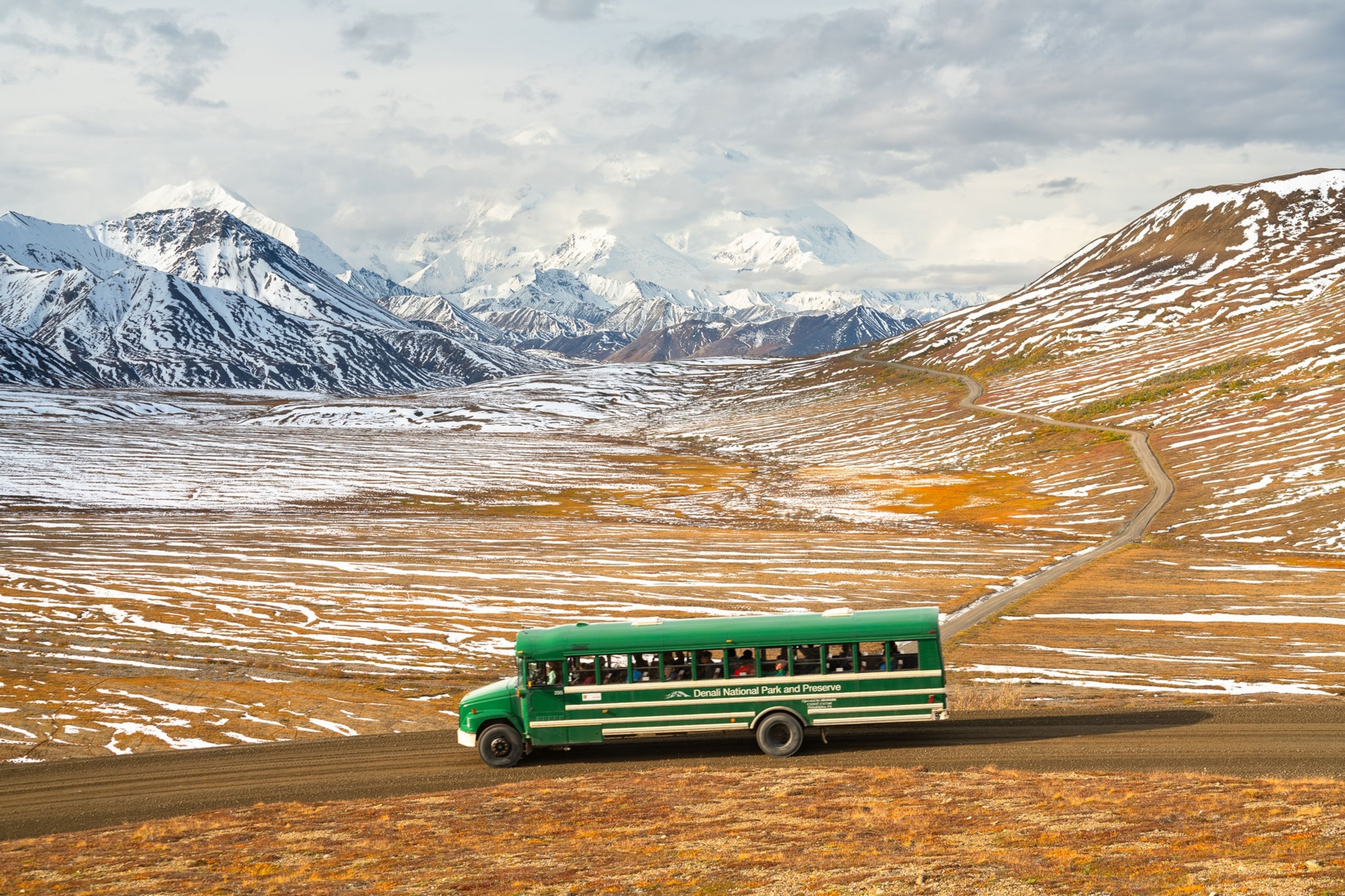 Visitors in Denali National Park and Preserve ride a non-narrated green transit bus to get from the Denali Bus Depot to points throughout the park.