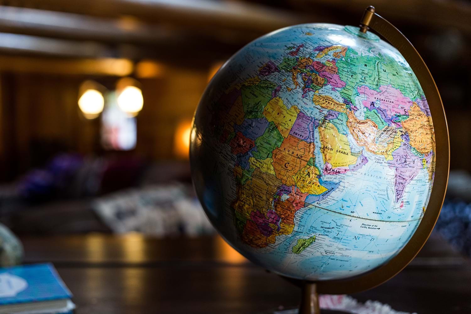 Globe on a wooden table, representing global travel destinations