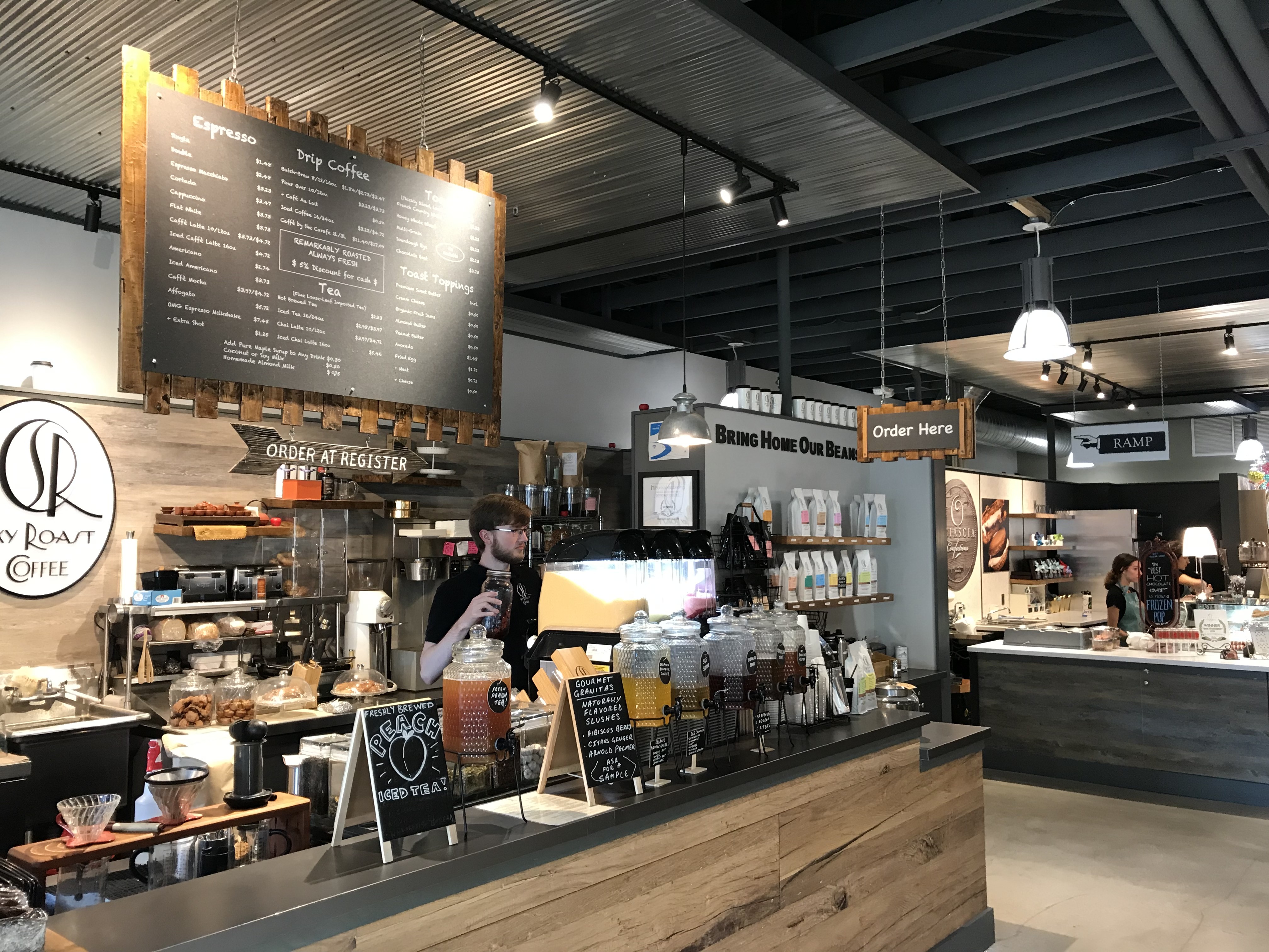 Variety of food stalls inside New Hope Ferry Market, a food hall