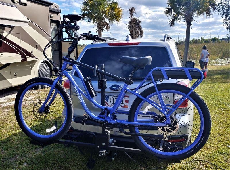 A heavier Pedego cargo e-bike mounted on the Swagman rack, testing weight capacity limits.