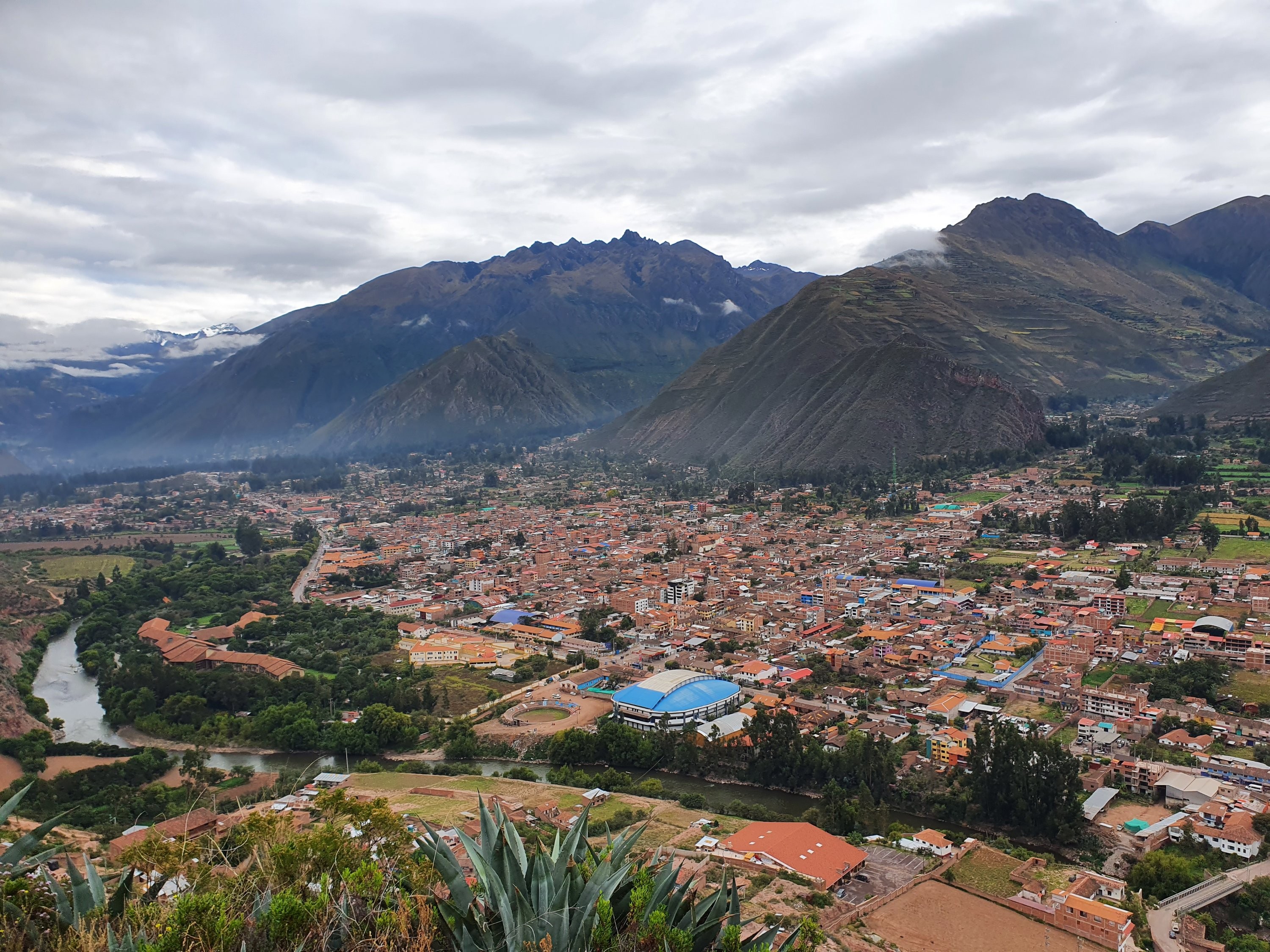 The lush Urubamba Valley landscape, a scenic backdrop to your Peru travel itinerary in the Sacred Valley.