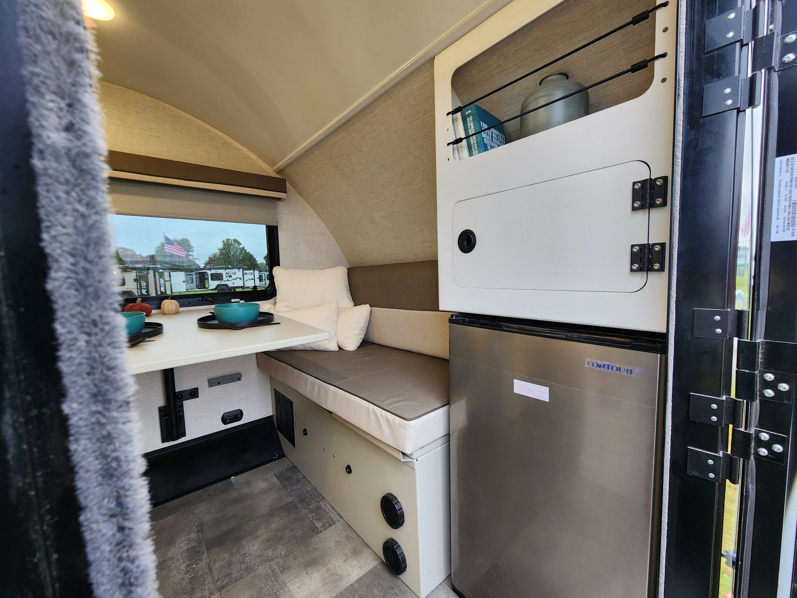 Close-up of the Encore RV VENŪ 1500 lb travel trailer's kitchen area, featuring a sink and countertop.