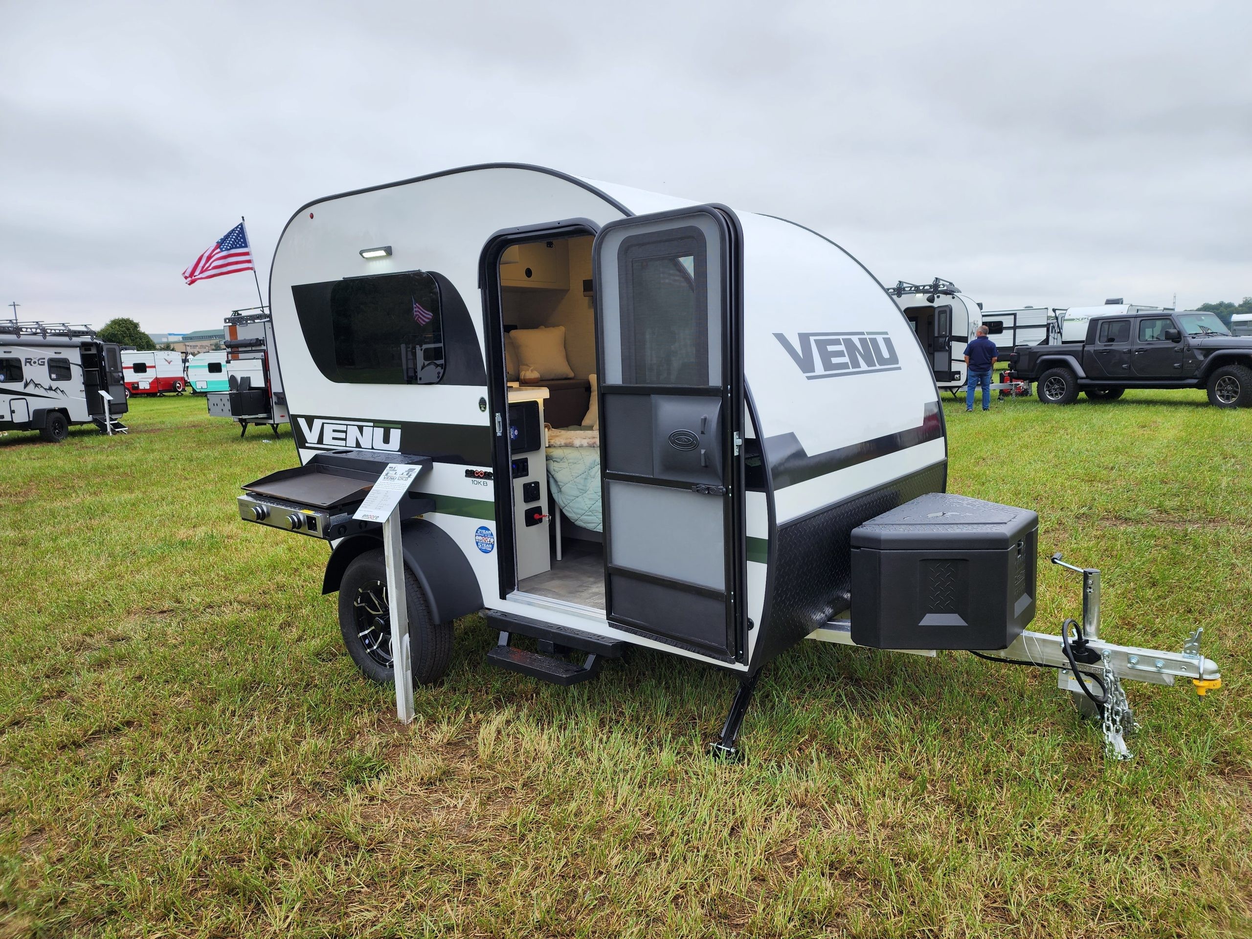 Side profile of the Encore RV VENŪ 1500 lb travel trailer, demonstrating its manageable length and towing suitability.