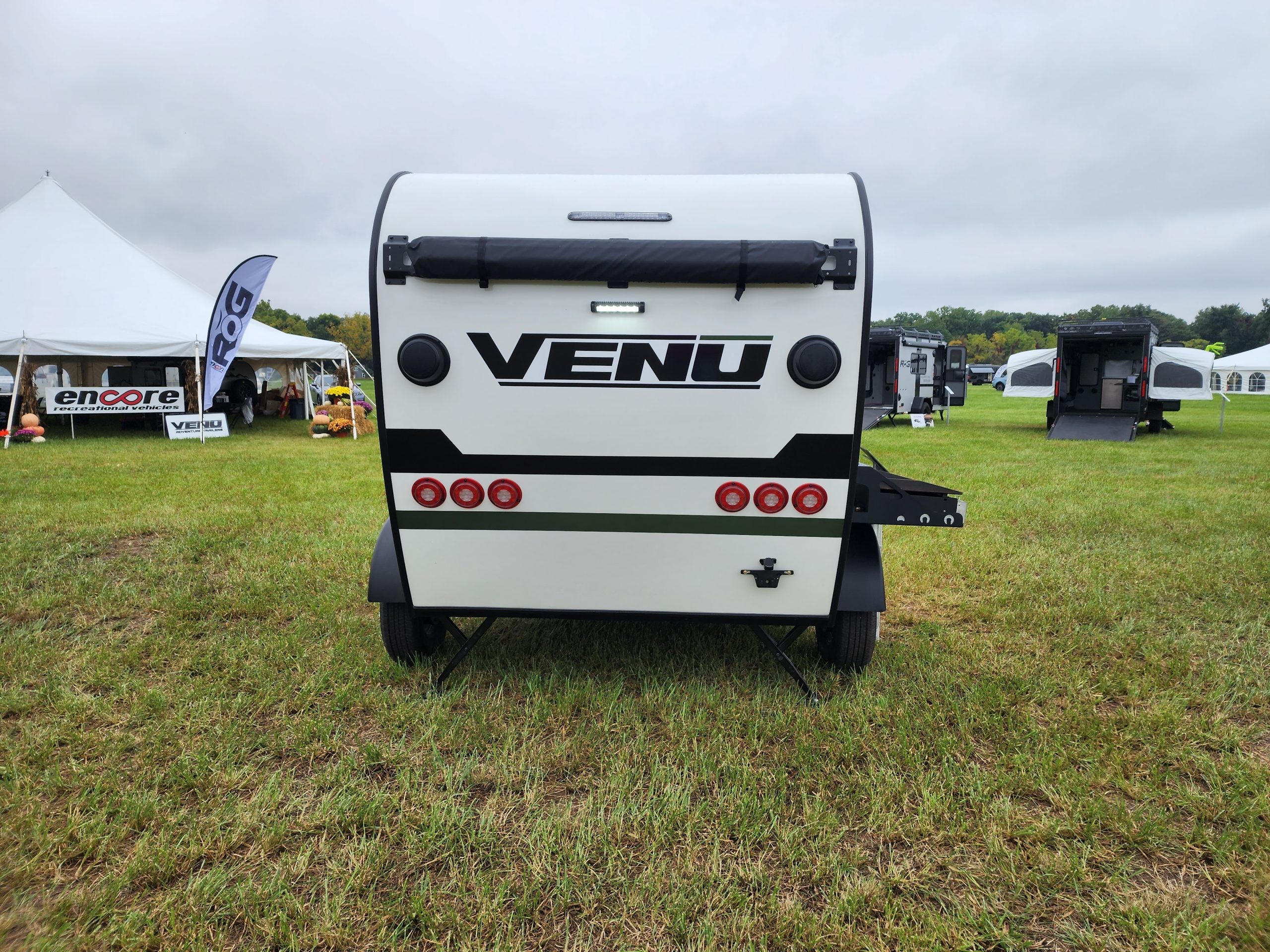 Rear view of the Encore RV VENŪ 1500 lb travel trailer, emphasizing its compact and easily maneuverable size.