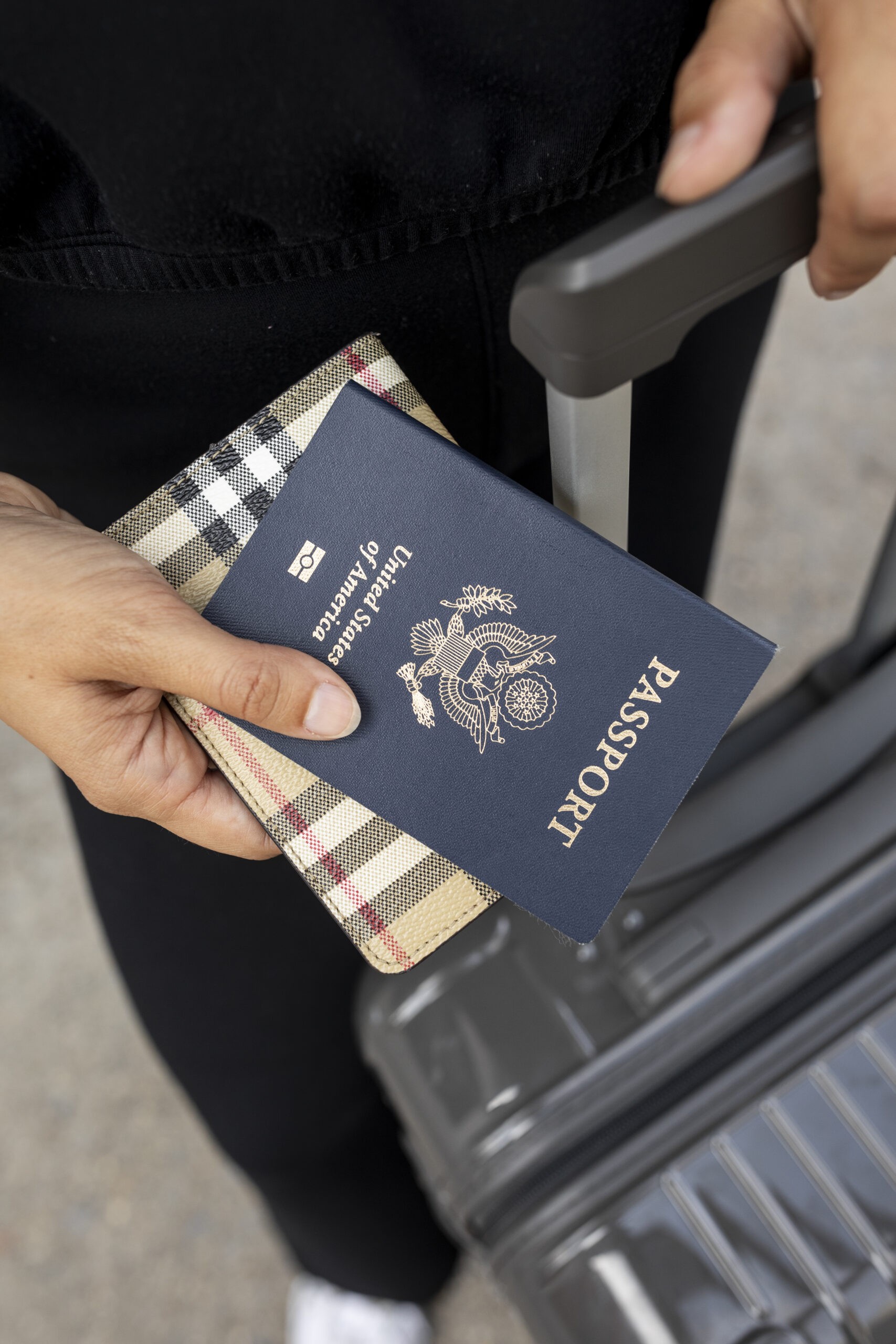 Woman packing suitcase for international travel