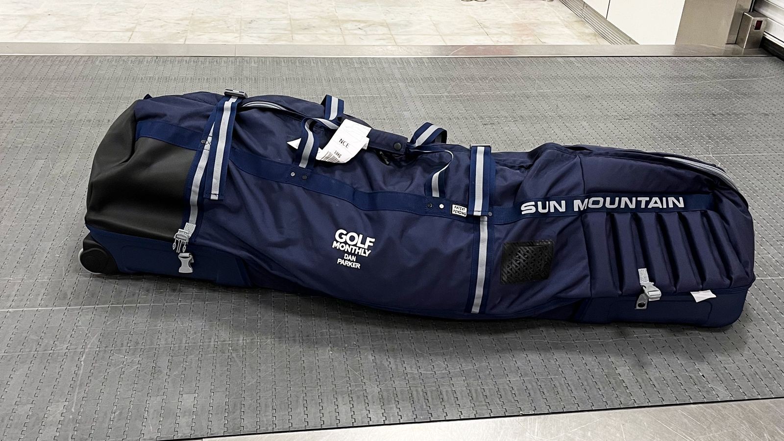 Sun Mountain Kube Travel Cover showcasing its hard case shell and compact, foldable design