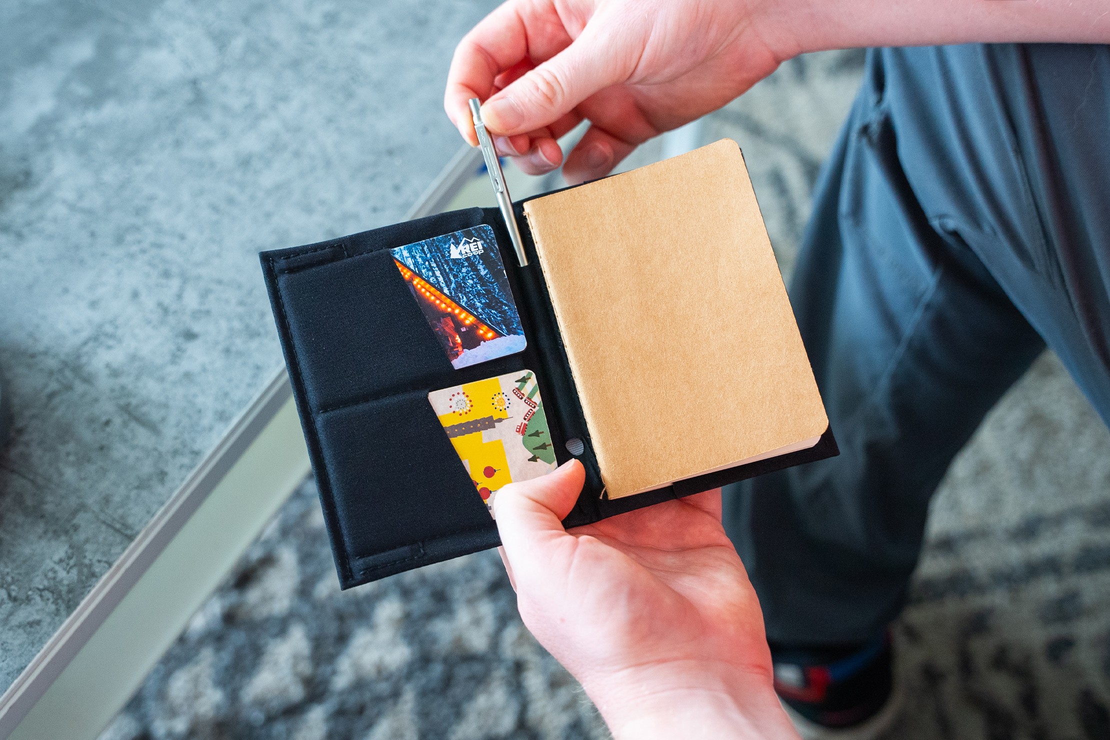 SlimFold Passport Wallet Review highlighting its AirTag pocket and card capacity.