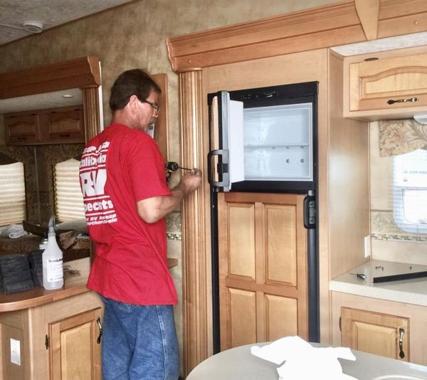 New travel trailer refrigerators ready for installation, representing options after considering travel trailer fridge repair.