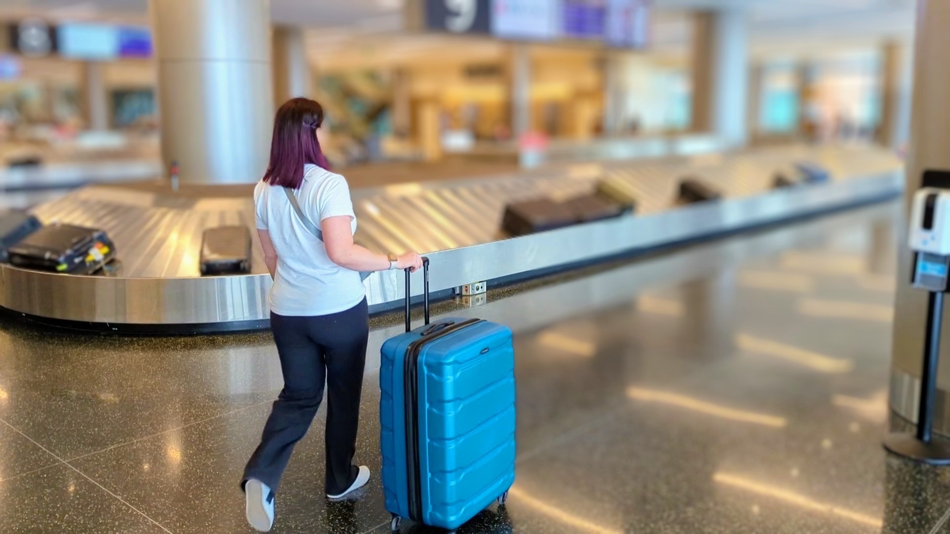 Heavy packer choosing a large suitcase