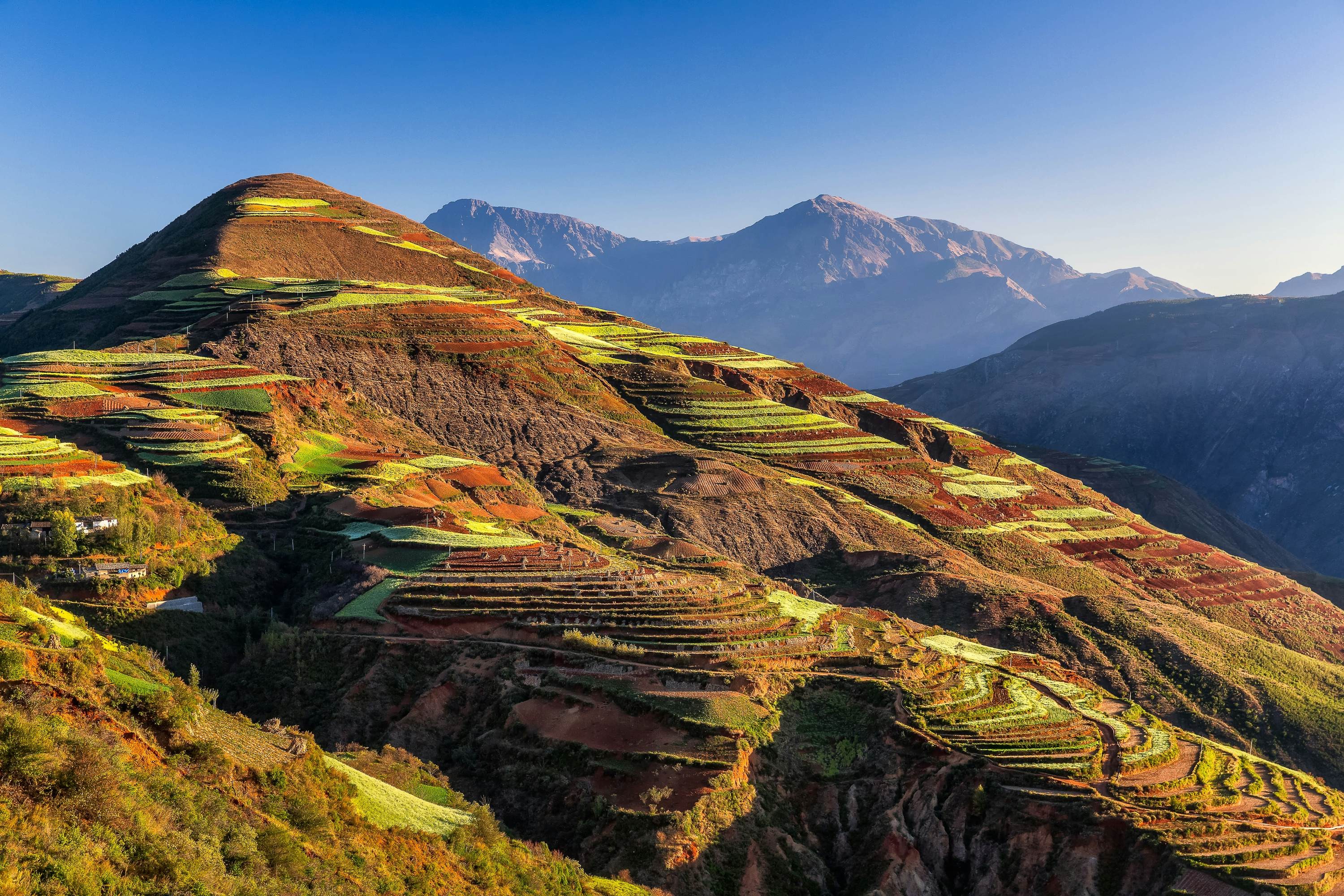 Yunnan, China, rice terraces carved into hillsides, showcasing the diverse landscapes of this southwestern province