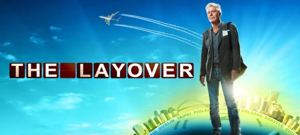 Anthony Bourdain in The Layover show, showcasing his energetic travel style.