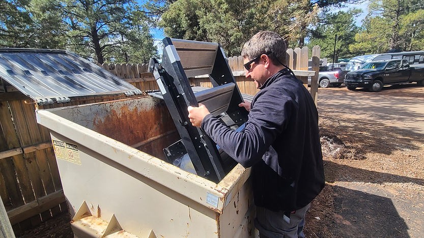 Humorous image of Anthony seemingly effortlessly throwing away SolidStep RV steps