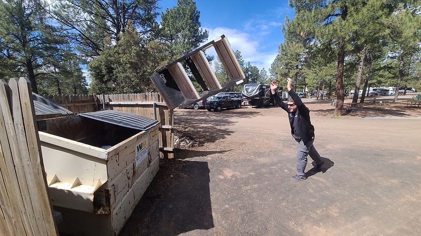 Image of SolidStep RV steps being discarded, symbolizing the upgrade to Torklift Glowsteps