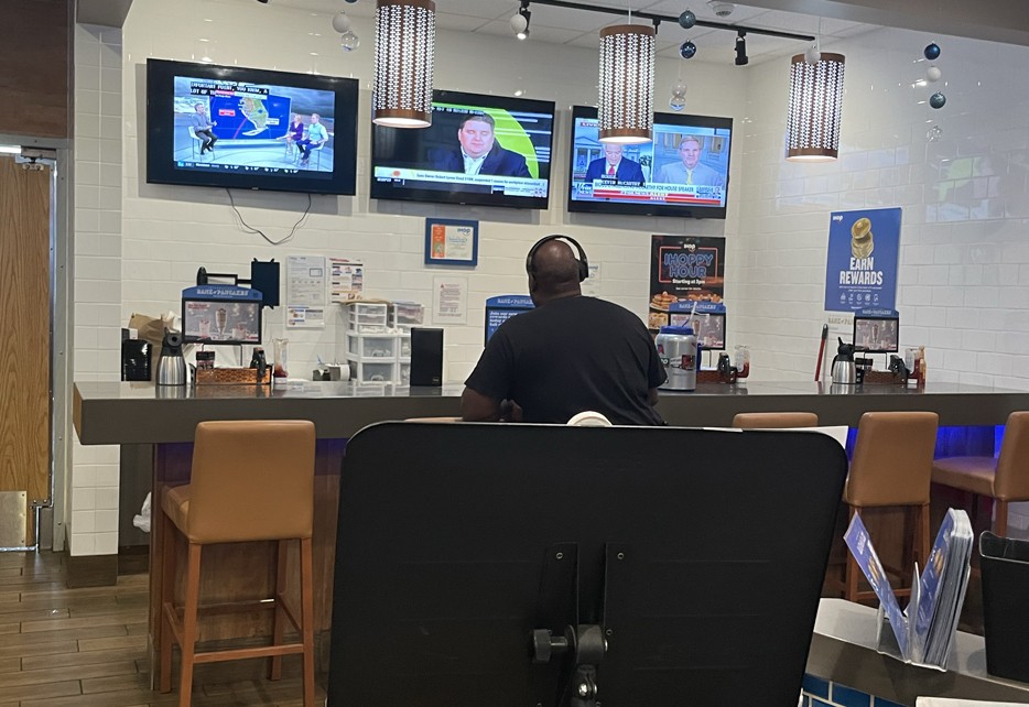 Trucker Bar inside the IHOP at Davy Crockett TA Travel Center, featuring individual stools and community seating for drivers and locals.