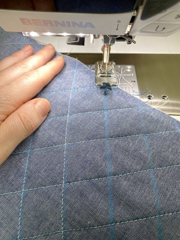 Topstitching the second set of diagonal lines to create a quilted pattern.