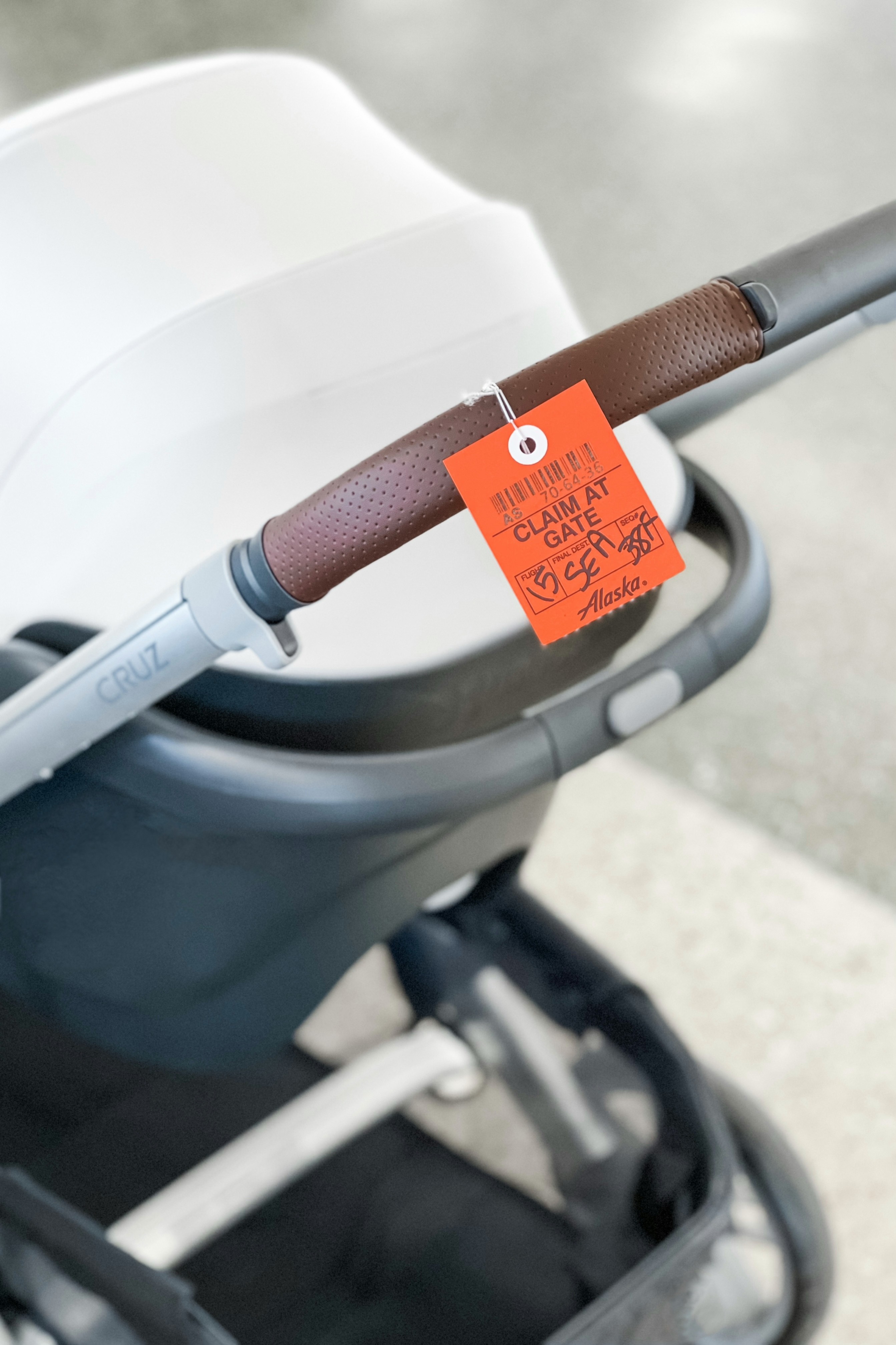 UppaBaby stroller and car seat, illustrating gate-checked baby gear ready for air travel.