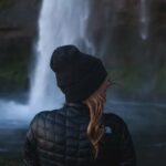 Woman overlooking a Patagonian landscape, highlighting the need for appropriate summer gear for travel Patagonia