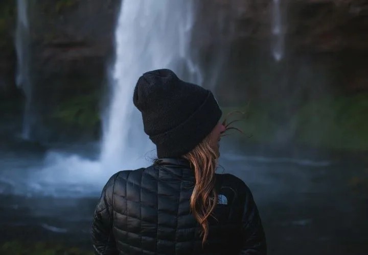 Woman overlooking a Patagonian landscape, highlighting the need for appropriate summer gear for travel Patagonia