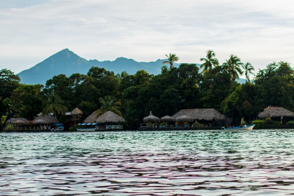 Boats navigate the Granada Islets, with the Mombacho Volcano in the distance, Nicaragua