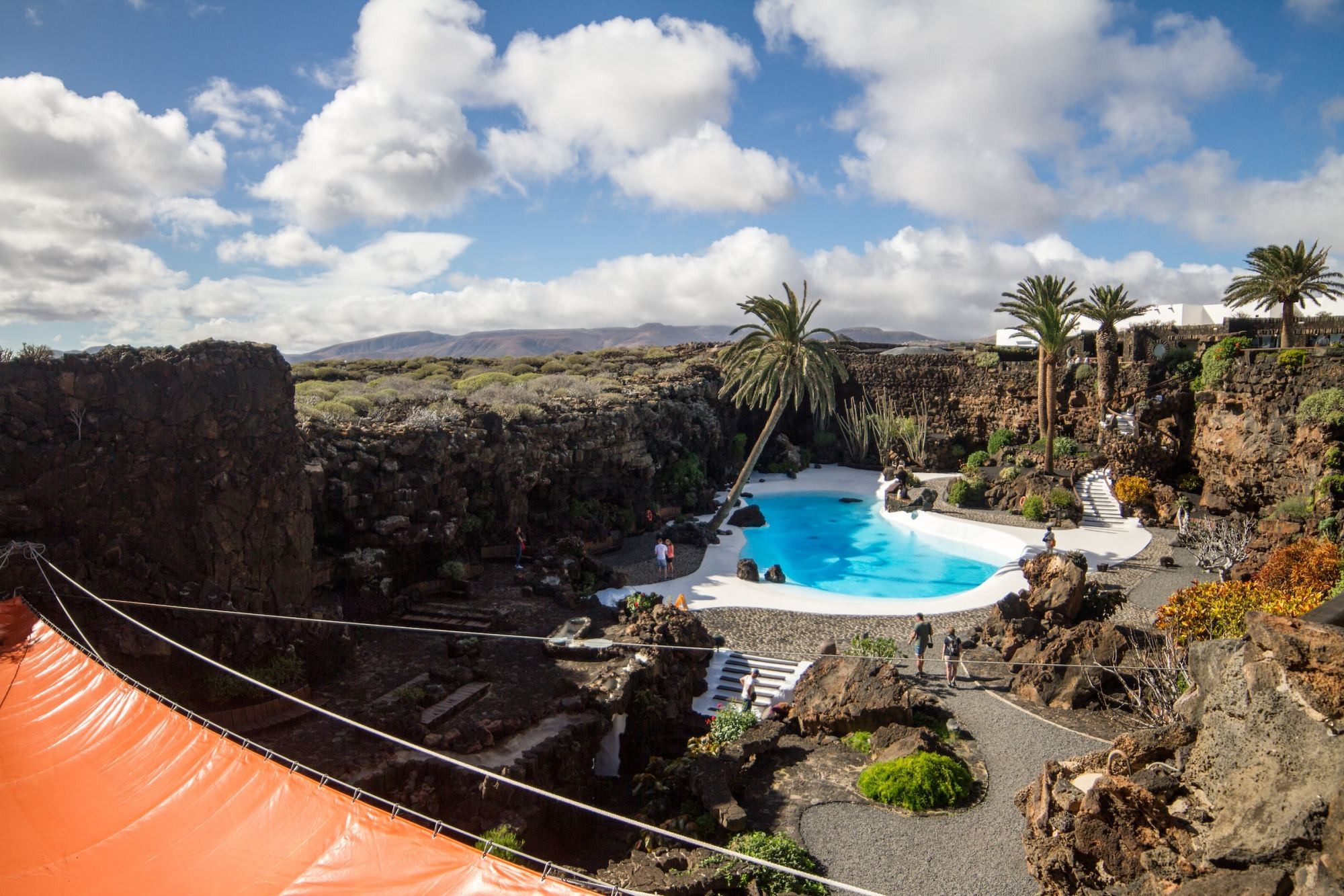 Guests stroll around the hidden grounds of a resort in Punta Mujeres, Spain