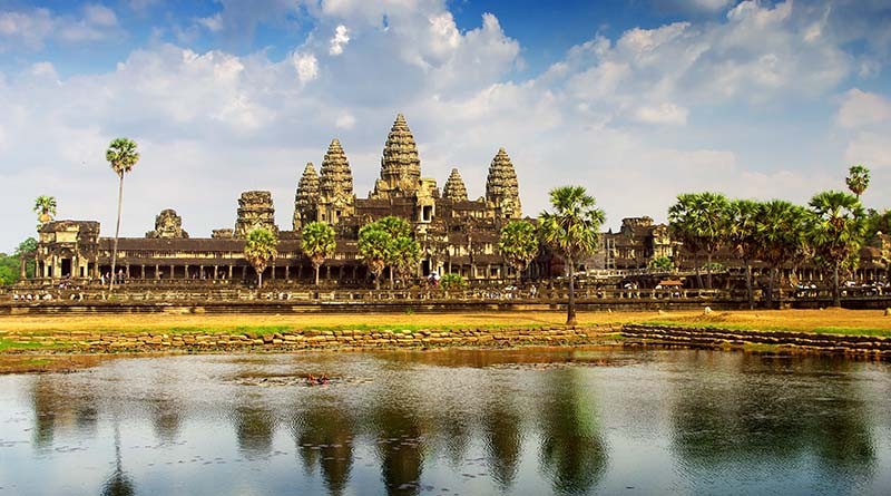 Angkor Wat Temple at sunrise, showcasing the ancient architecture and serene atmosphere of Cambodia, a prime destination in Southeast Asia for warm weather in January.