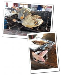 An array of grilled fish and seafood, representing local cuisine in Antigua