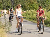 People biking along the Atlanta Beltline, a great way to travel around and experience Atlanta's outdoor spaces