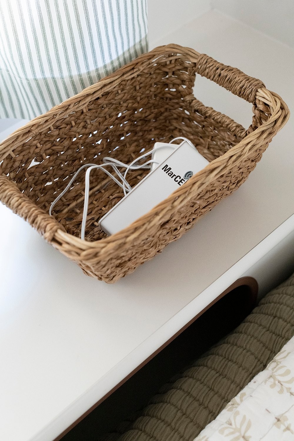 Baskets under camper bed for charger and thermostat storage