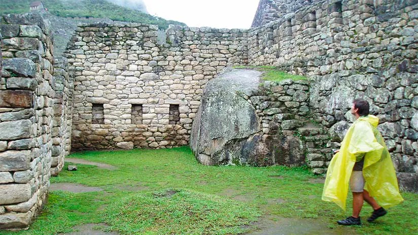 Image of Machu Picchu in the rainy season with mist and lush greenery