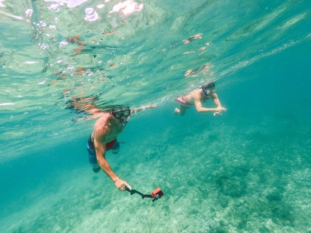 People enjoying snorkeling in the clear waters of Smith Bay Beach Park