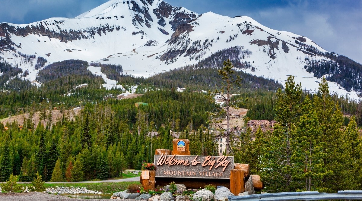 Sign for Big Sky, Montana, in a snowy landscape, indicating a winter destination.