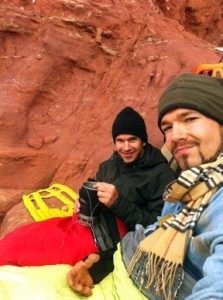 The author and climbing partner Adam Papilion bivouacked on a ledge high up Titan, Fisher Towers, wearing travel coats