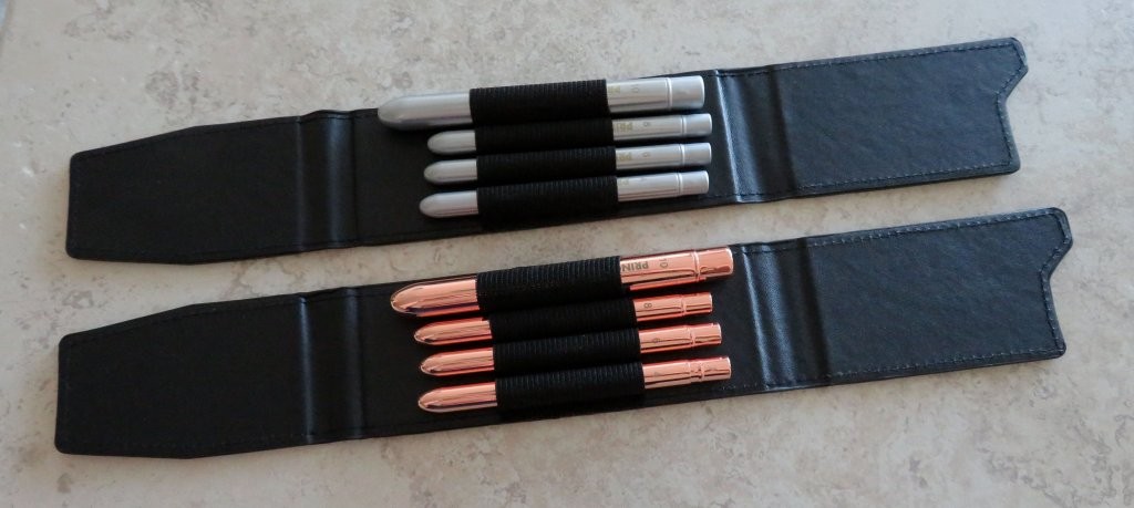 Two travel brush sets in cases by Princeton