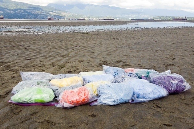 Travel towels sealed in plastic bags for an odor resistance test, evaluating their ability to remain fresh after damp use.