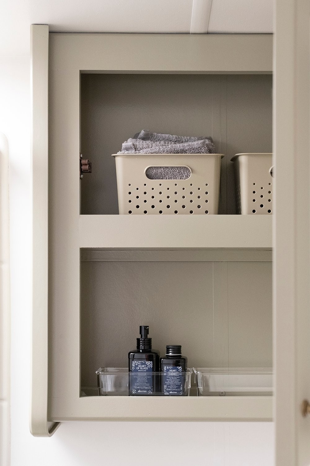 Storage bins in camper bathroom medicine cabinet