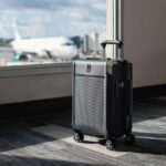 International Luggage by the window at the airport