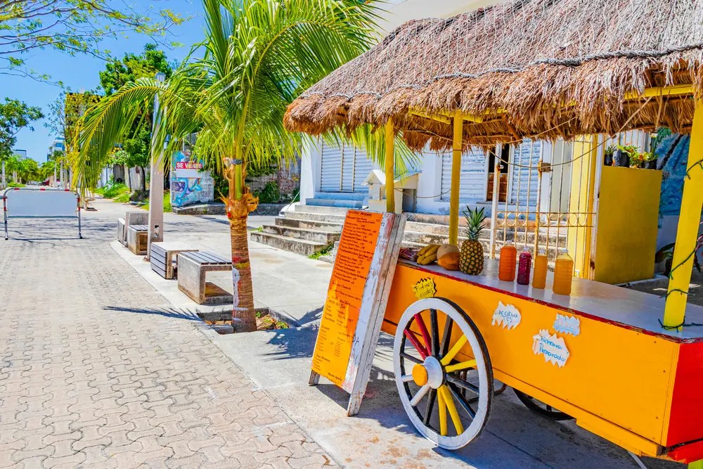 Orange juice shop on wheels in Playa del Carmen Mexico.