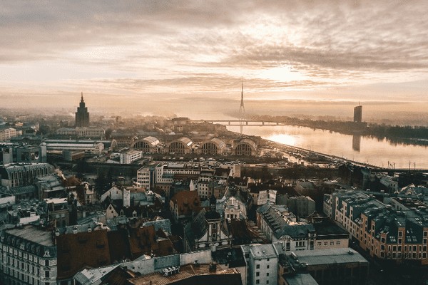 Riga's Old Town, a UNESCO World Heritage site, showcasing its medieval architecture and vibrant atmosphere, promoting Riga as an affordable and family-friendly European gem