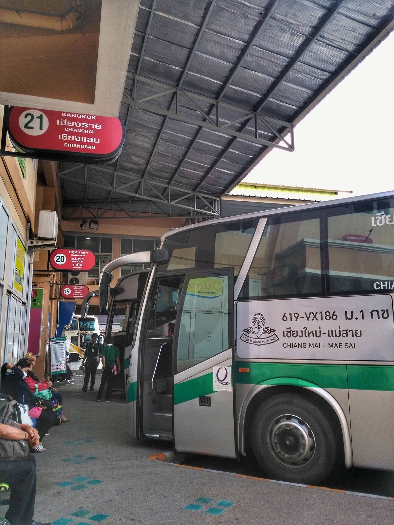 Bus terminal in Chiang Mai, Thailand with a bus to Mae Sai parked at platform 21.