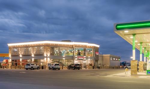 Coffee Cup Travel Plaza Front View at Night Showcasing Well Lit Parking Area