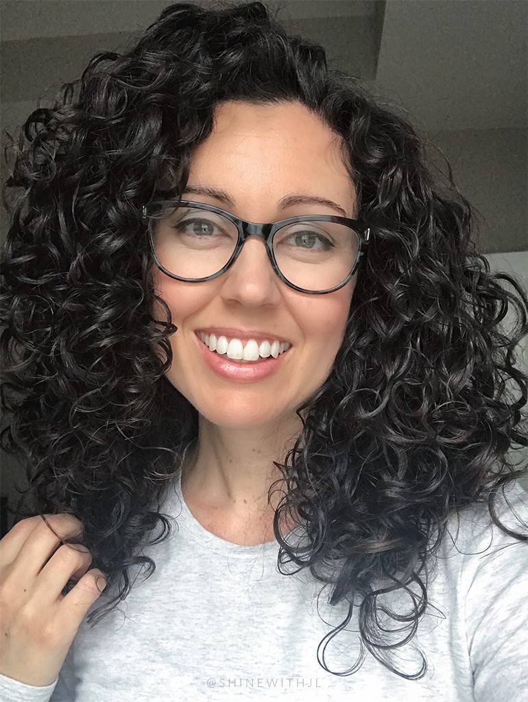 Shoulder Length Curly Hairstyle with Glasses and Travel Hair Dryer