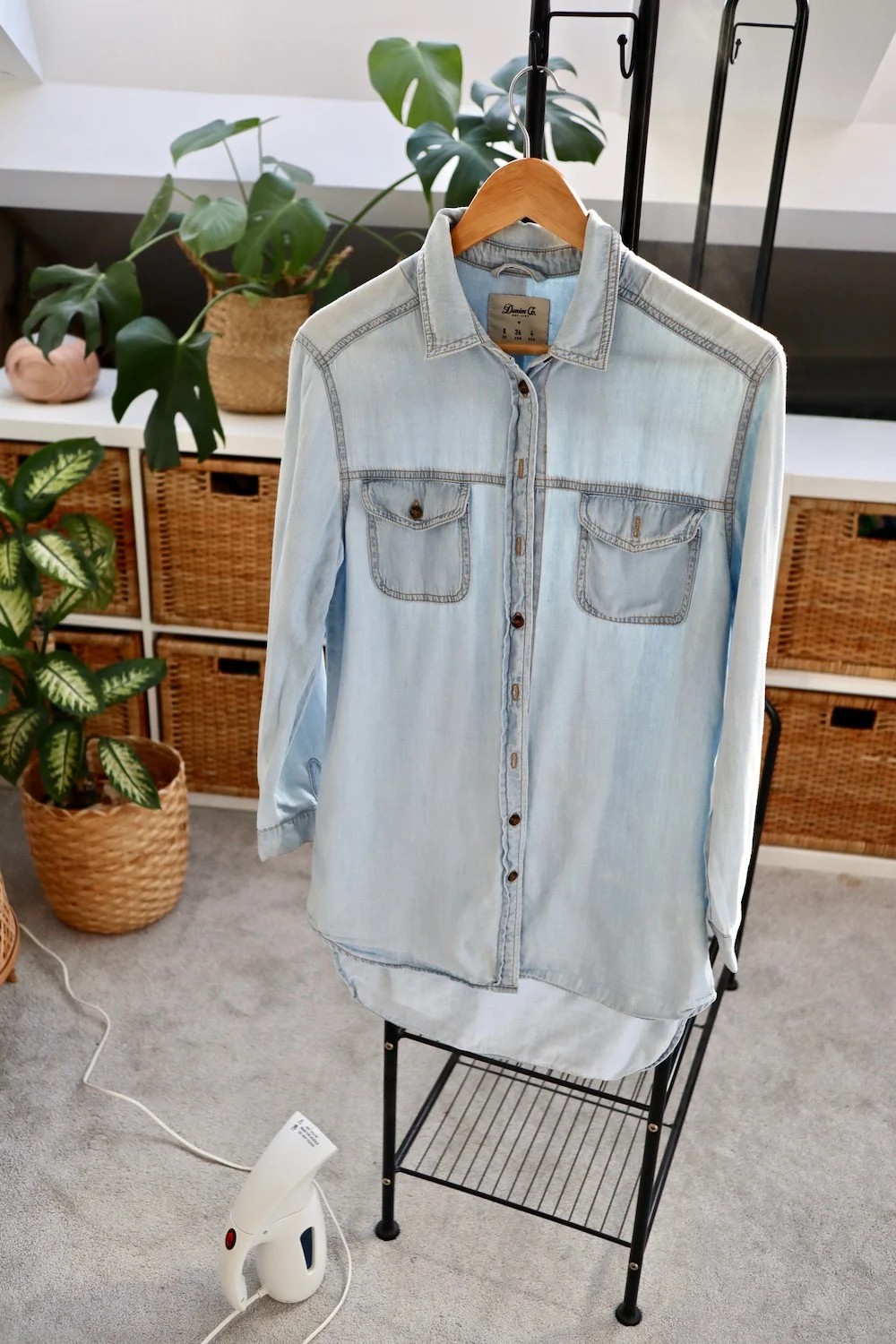 Denim shirt after steaming demonstrates wrinkle removal effectiveness of a travel steamer