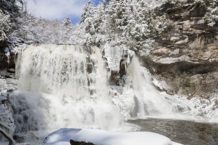 Scenic view of Blackwater Falls and surrounding winter landscape