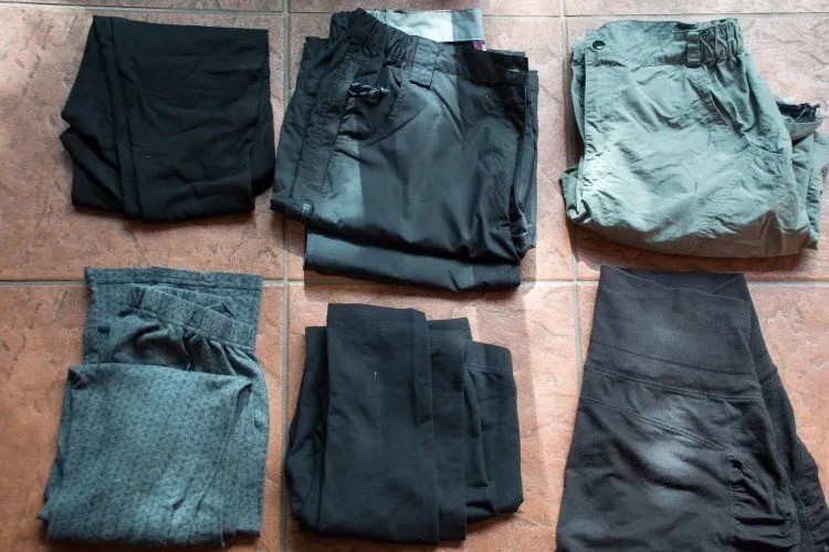 Hiking trousers and leggings laid out, showing versatile summer gear for travel Patagonia