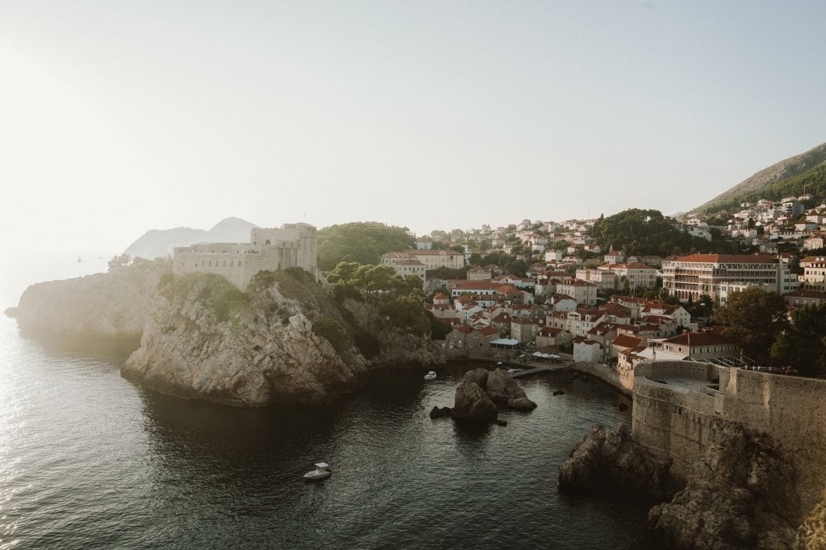 Serene Danče Beach in Dubrovnik, featuring crystal clear waters and rocky shoreline, ideal for relaxation during a Croatia travel itinerary.