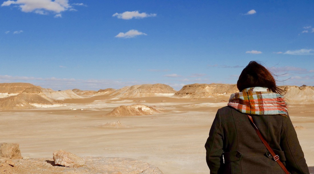 A traveler using a Travelwifi device while exploring a city.