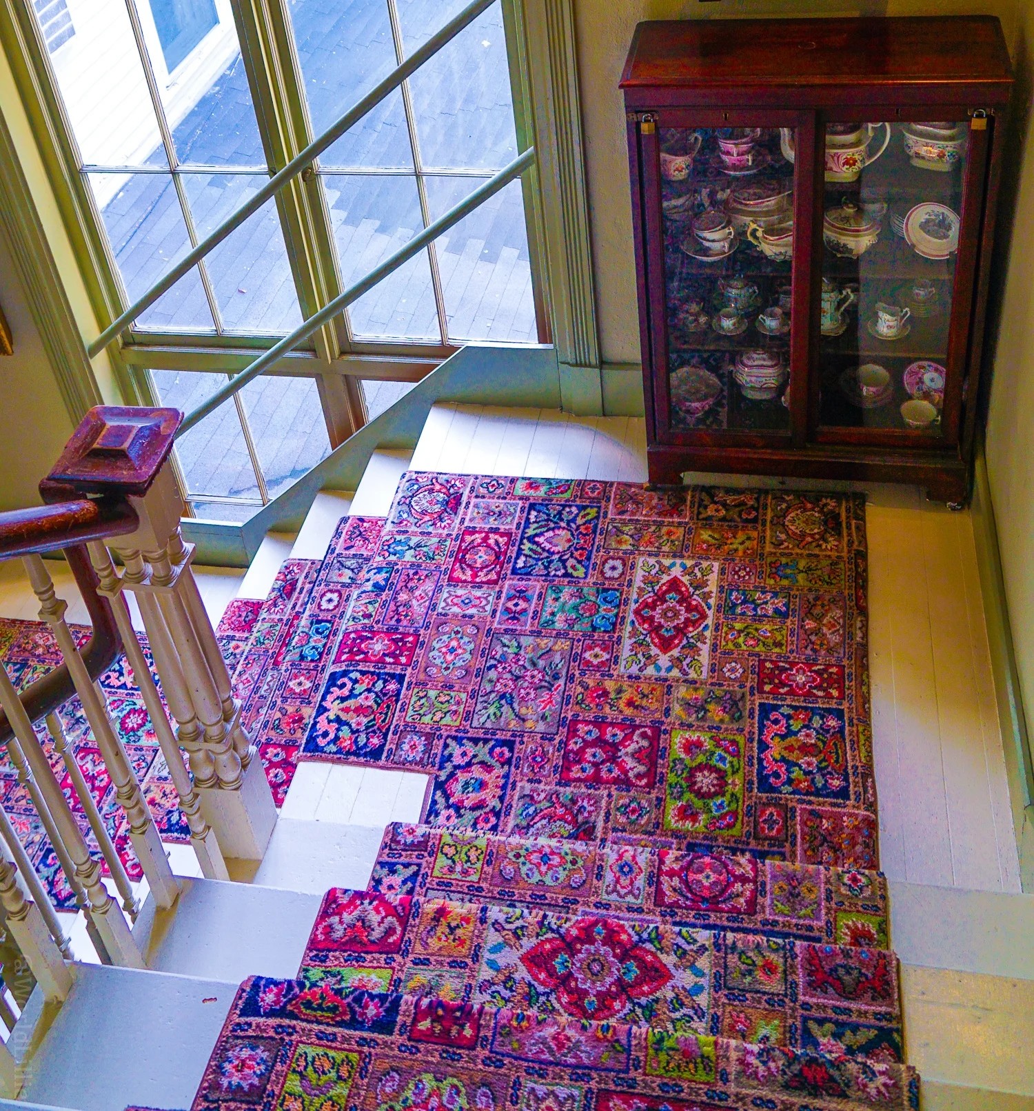 Ornate patterned carpets in an antique hotel, illustrating the global reach of travel spelling considerations