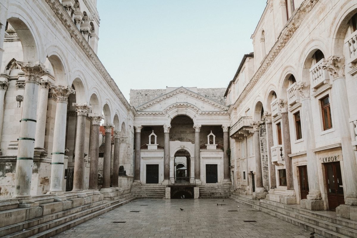 Sunrise view of Diocletian's Palace in Split, showcasing the ancient Roman architecture and peaceful atmosphere, a highlight of a Croatia travel itinerary.