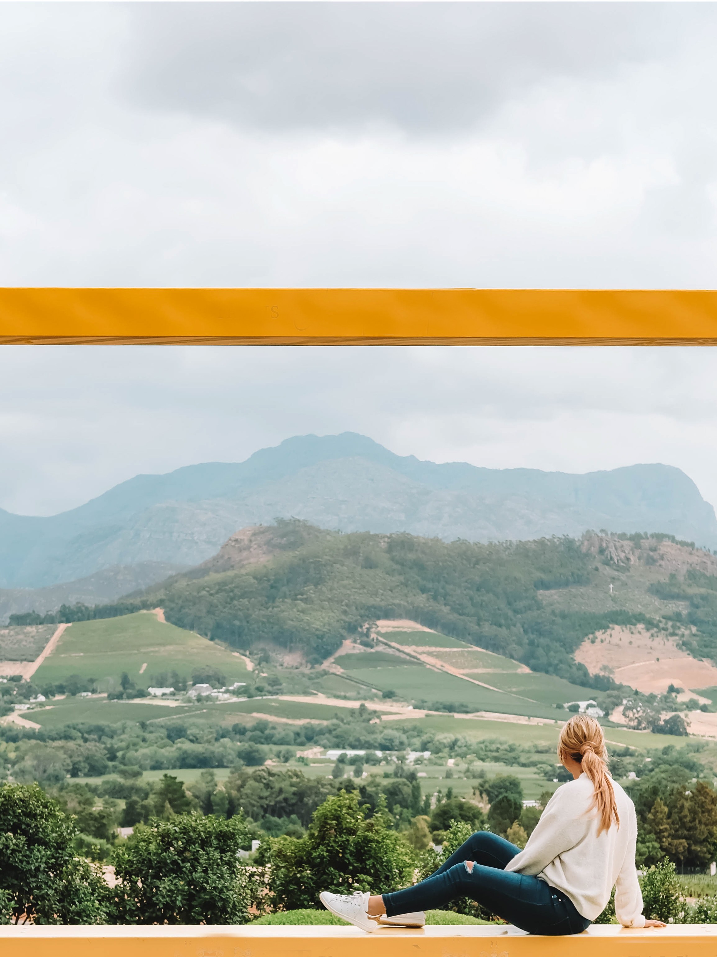 A scenic vineyard landscape in Franschhoek, South Africa, representing the type of hidden gem information found on local travel blogs