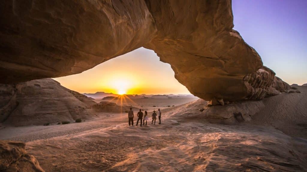 A group of people on a National Geographic Expedition in a desert landscape